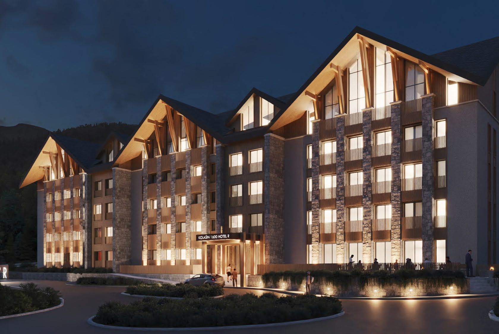 Evening view of the facade of the Kolašin 1600 hotel in chalet style with stone and wood finishes, Kolašin, Montenegro.