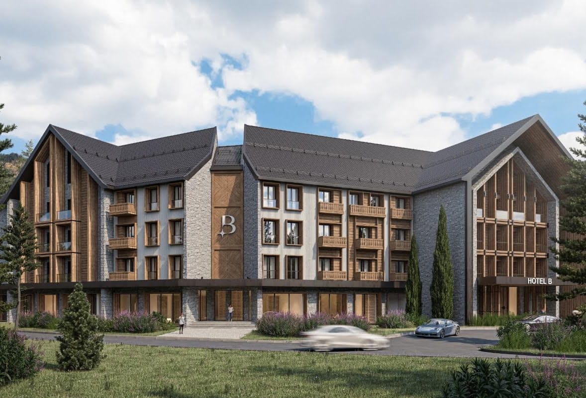 Modern residential complex Hotel B in Kolašin, Montenegro: stone and wood facade with balconies and parking.