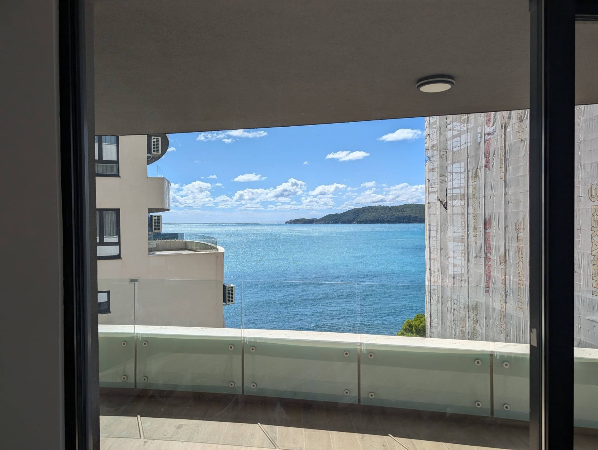 Sea view and view of St. Nicholas Island from the balcony of an apartment in Rafailovići, Montenegro.
