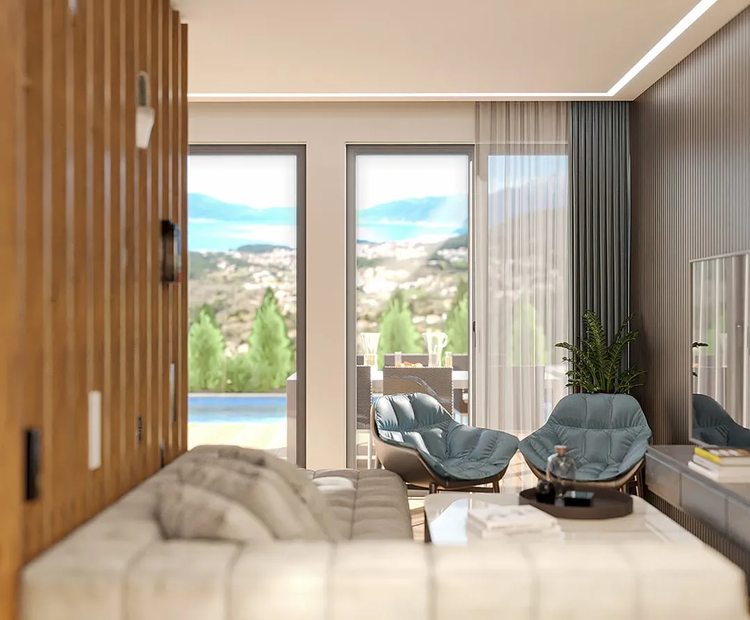 Modern living room with a white sofa, blue chairs, and large windows overlooking the sea and mountains.