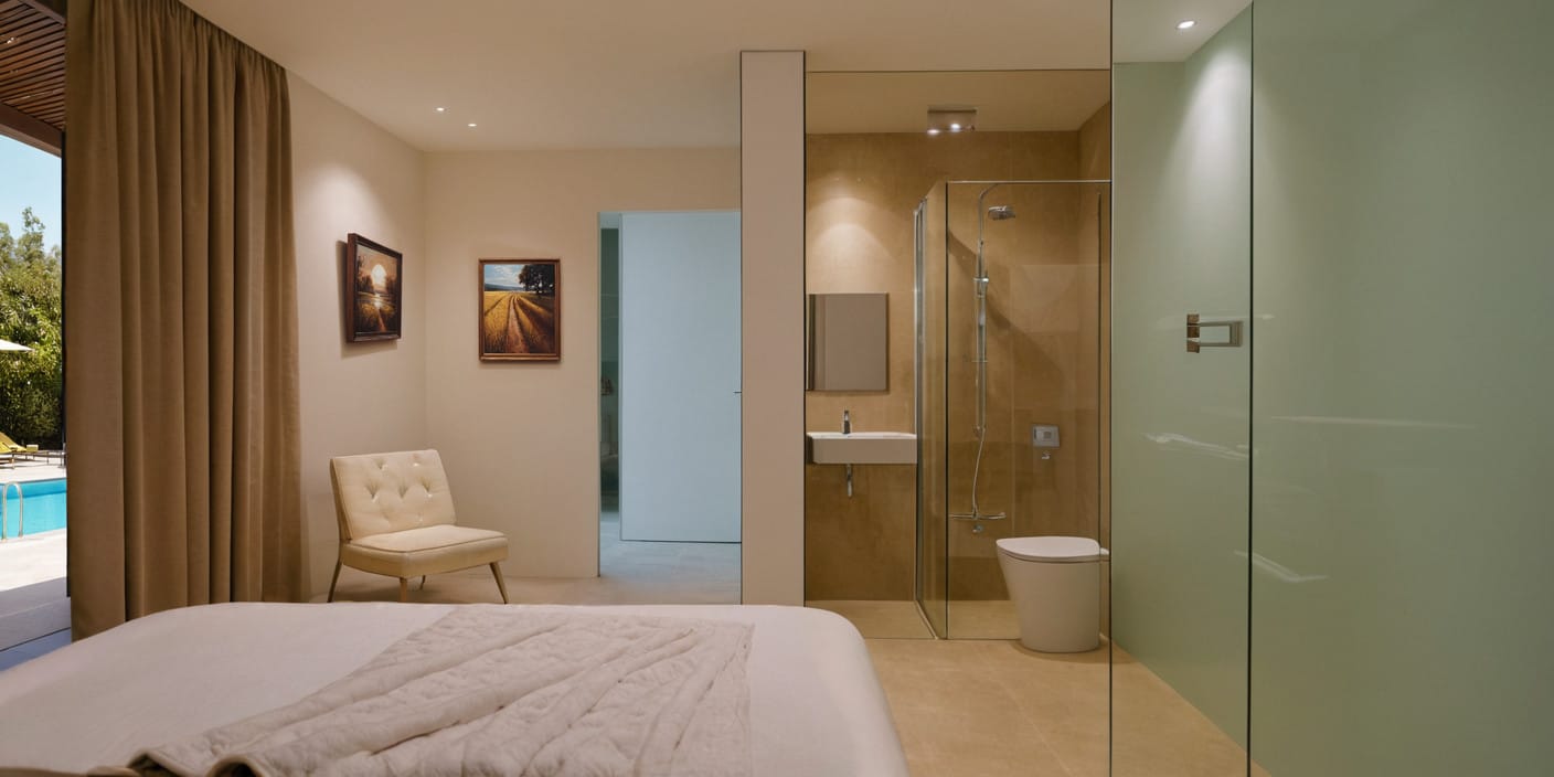 Modern bedroom with an en-suite bathroom and a view of the pool in a townhouse, Blizikuće, Montenegro. Designer interior.