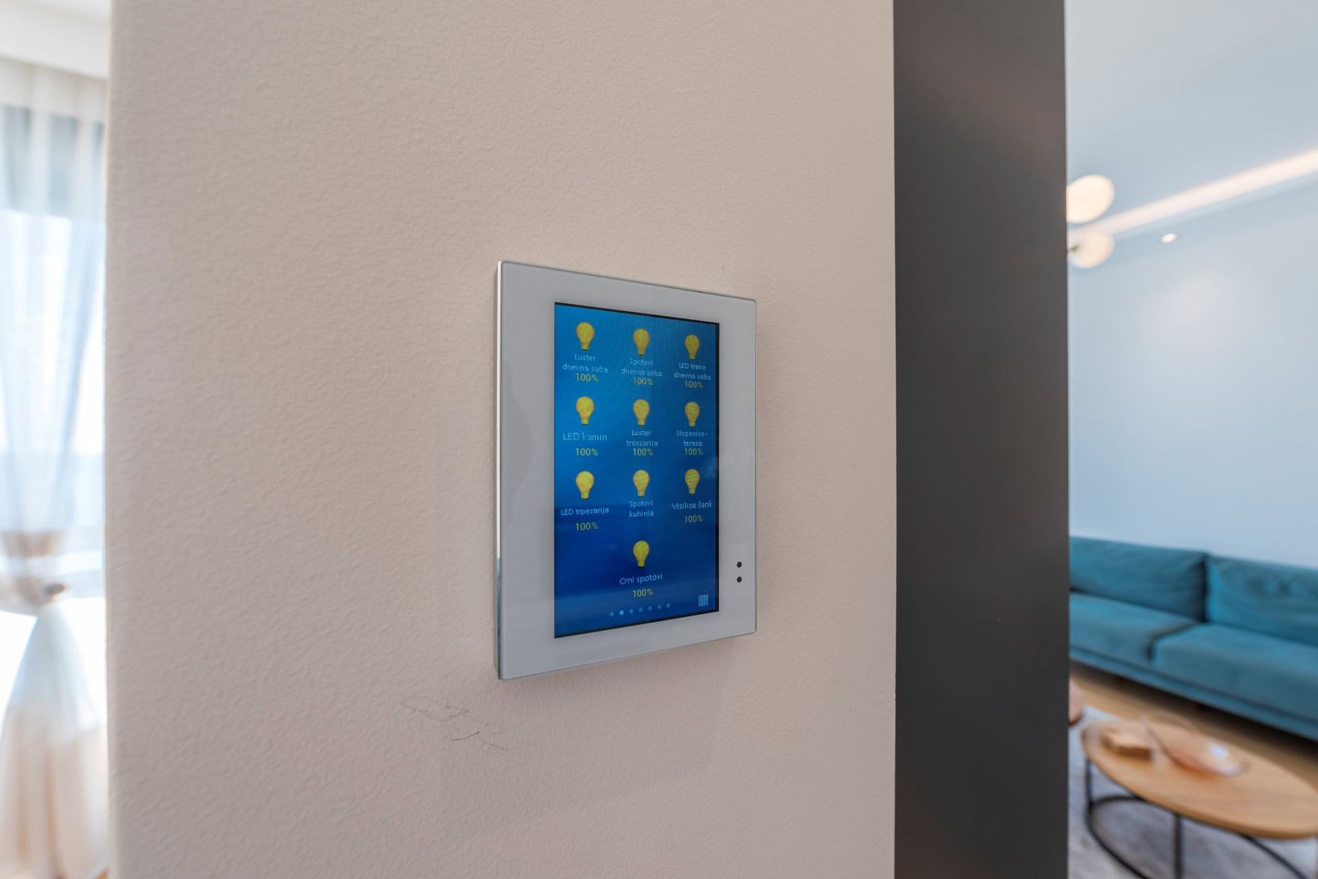 Touchscreen smart home control panel in the living room of a luxury house in Reževići, Montenegro.