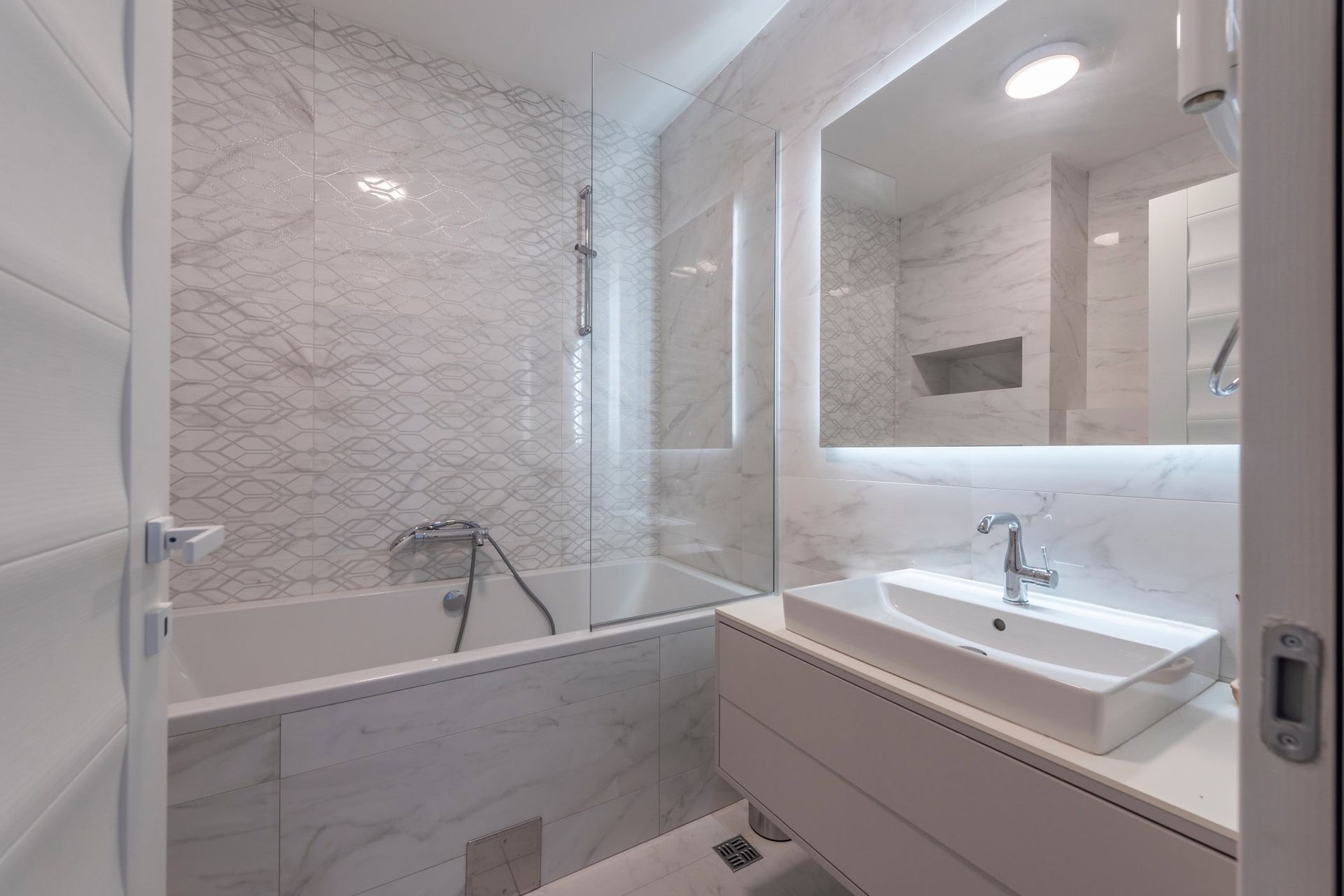 Modern bathroom with a shower cabin and marble-style finishes in a house, Reževići, Montenegro.