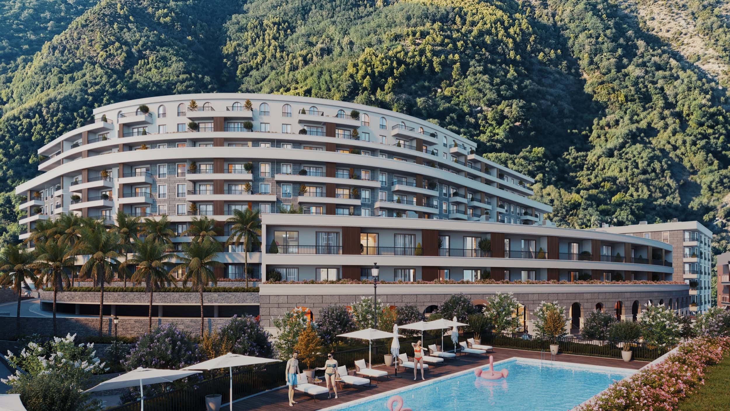Modern residential complex in Bečići, Montenegro: a multi-story building with a pool, terraces, and mountain views.