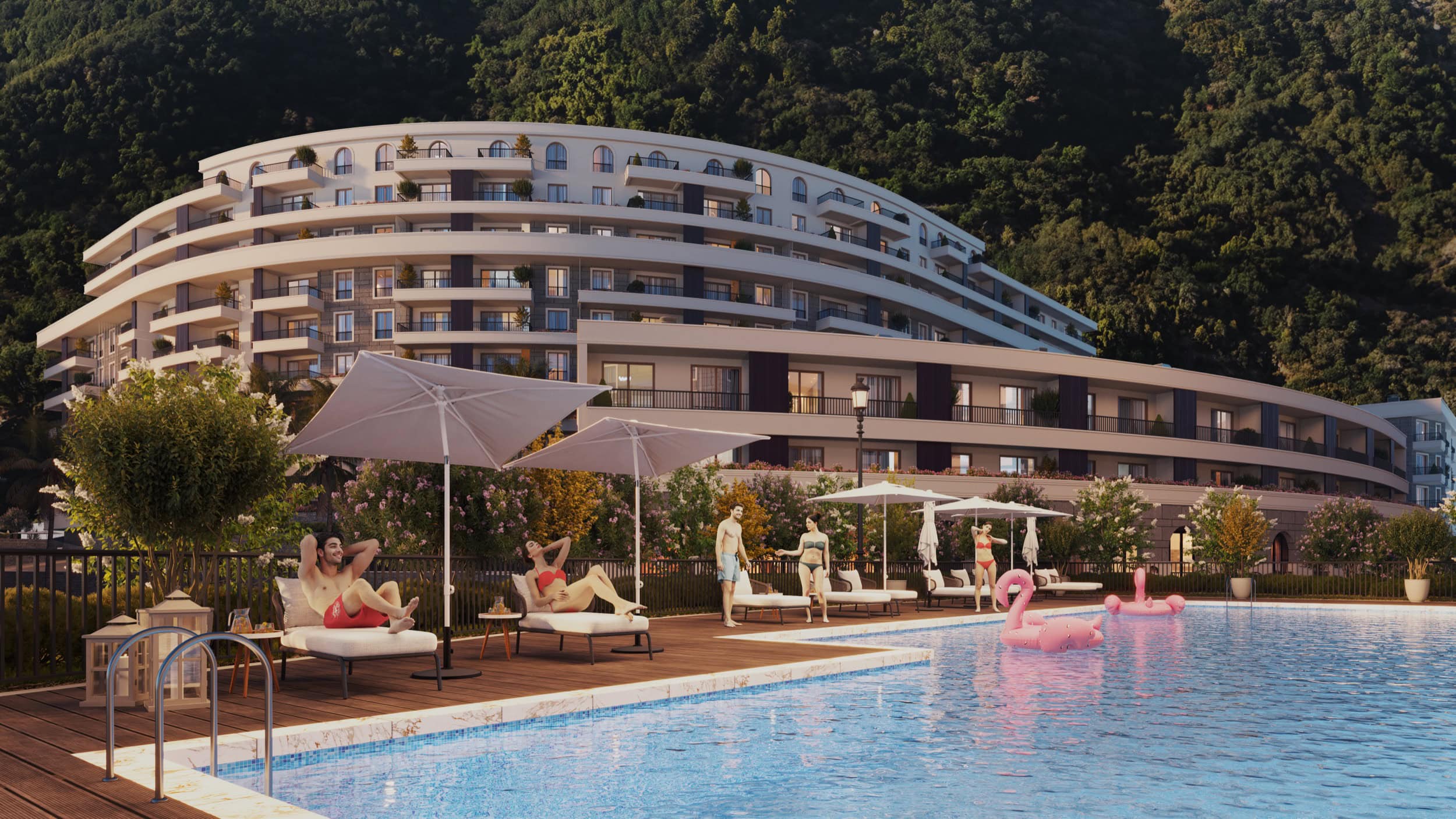 Residential complex in Bečići, Montenegro: a modern hotel with an outdoor pool, sun loungers, and mountain views.