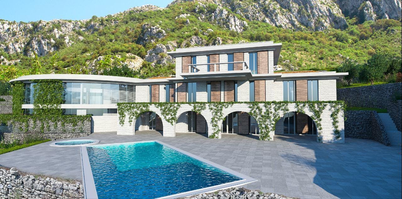 Modern villa with a pool and stone cladding in Blizikuće, Montenegro: view of the facade and terrace with mountains.