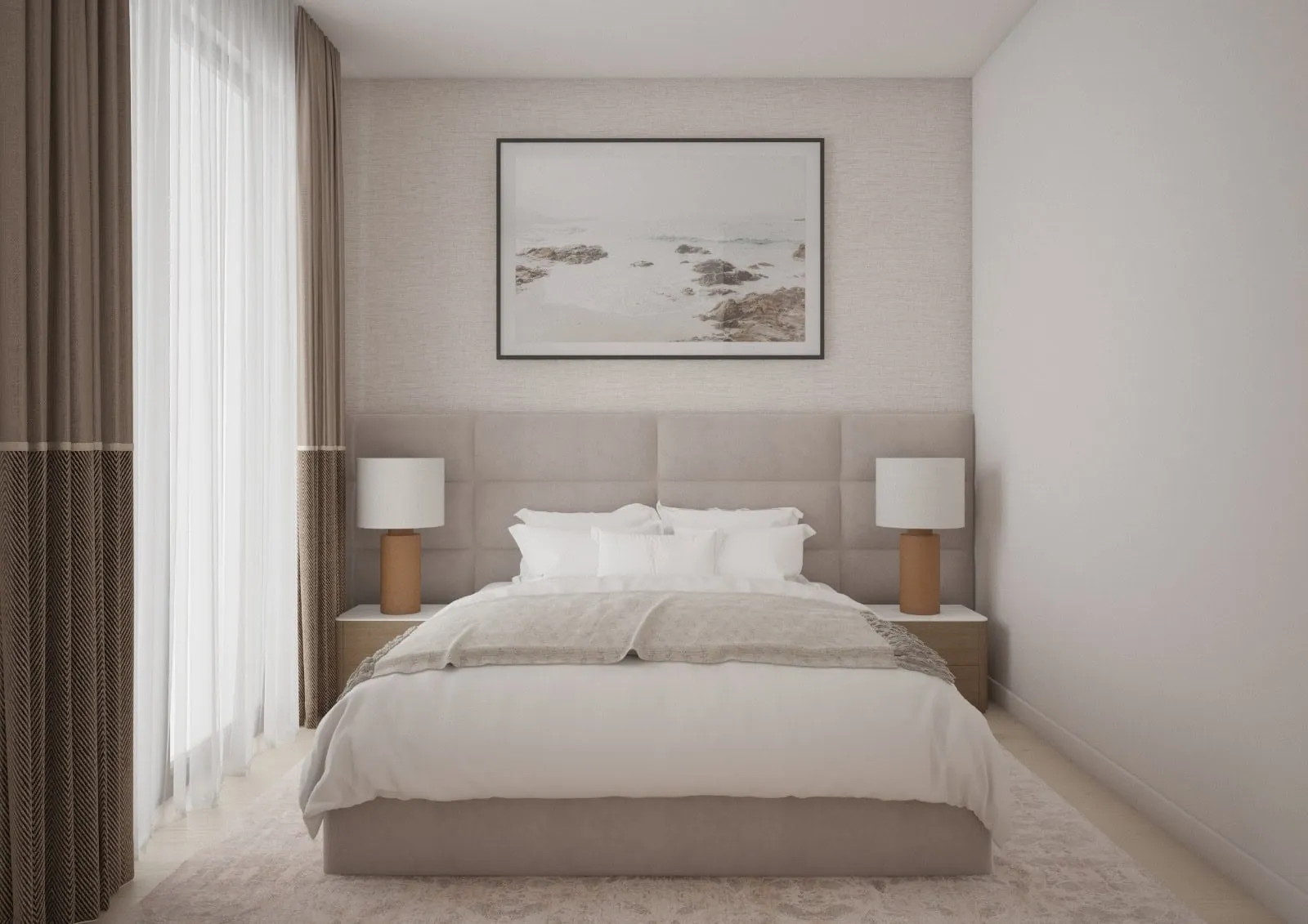 Modern bedroom featuring a large bed with upholstered headboard, matching lamps, and coastal wall art.