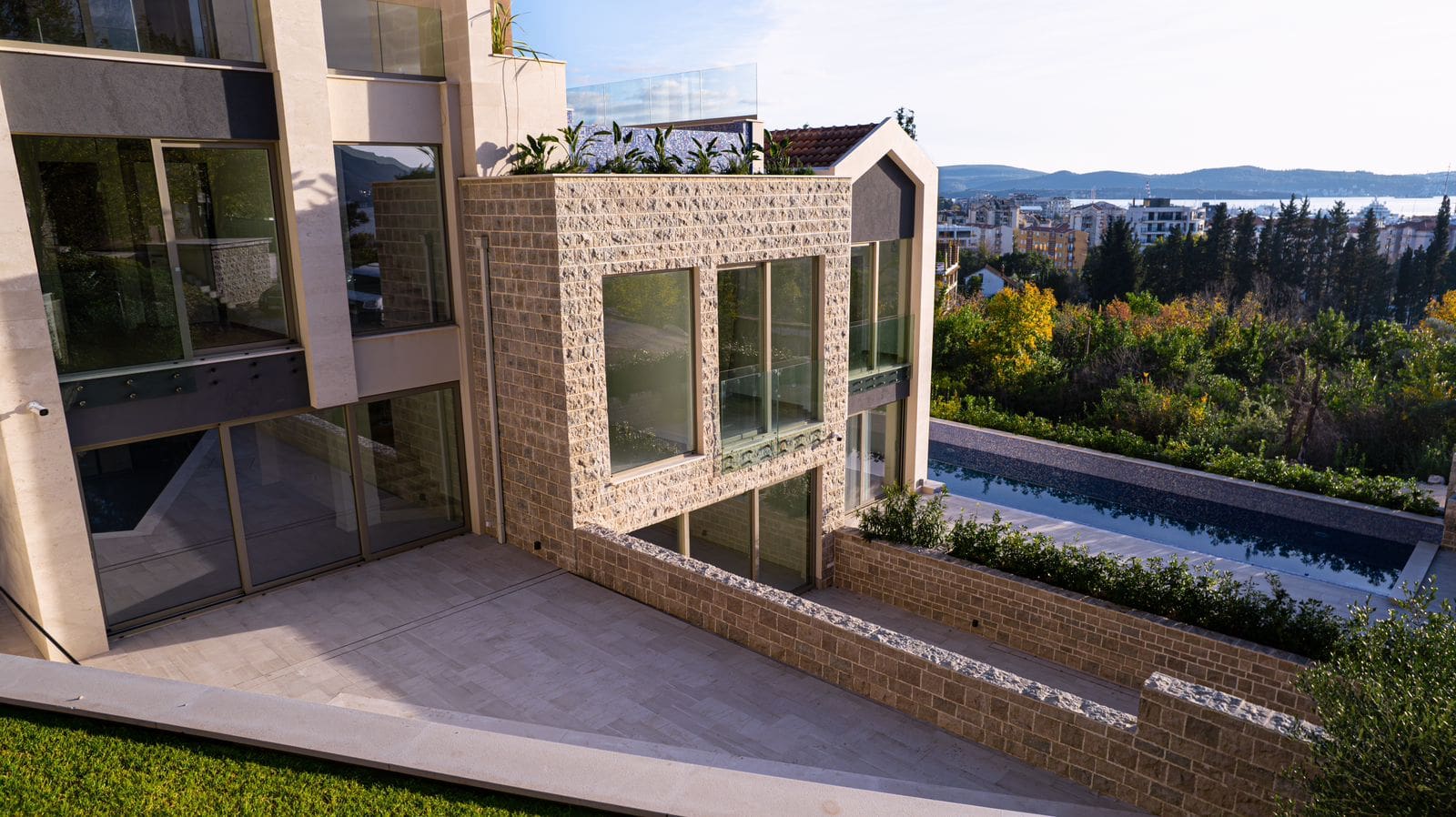 Modern villa with panoramic windows, a swimming pool, and sea views in Tivat, Montenegro. Luxury property.