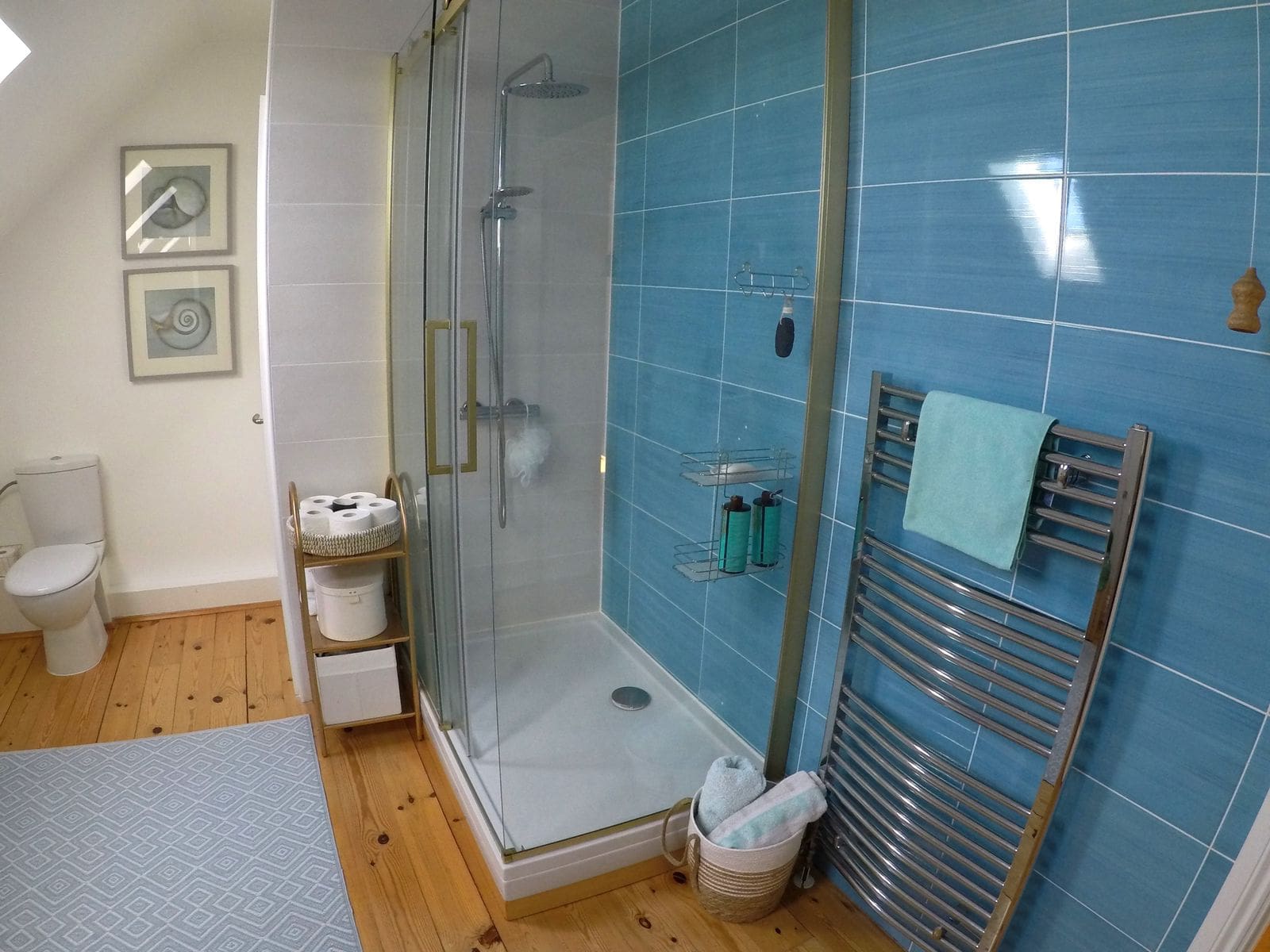 Bathroom with a shower cabin and blue tiles in a house, Krymovitsa, Montenegro: modern fixtures and decor.