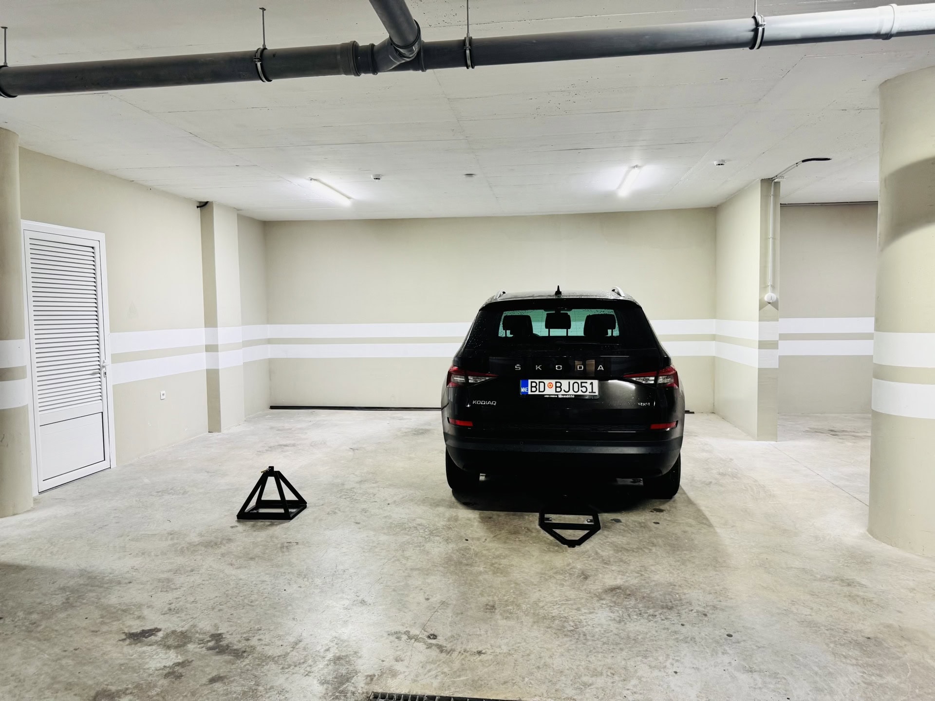 Private parking space in the underground garage of a residential complex in Bečići, Montenegro.