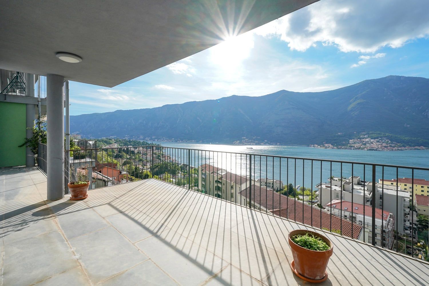 Spacious terrace with panoramic views of Kotor Bay and the mountains, apartment in Dobrota, Montenegro.
