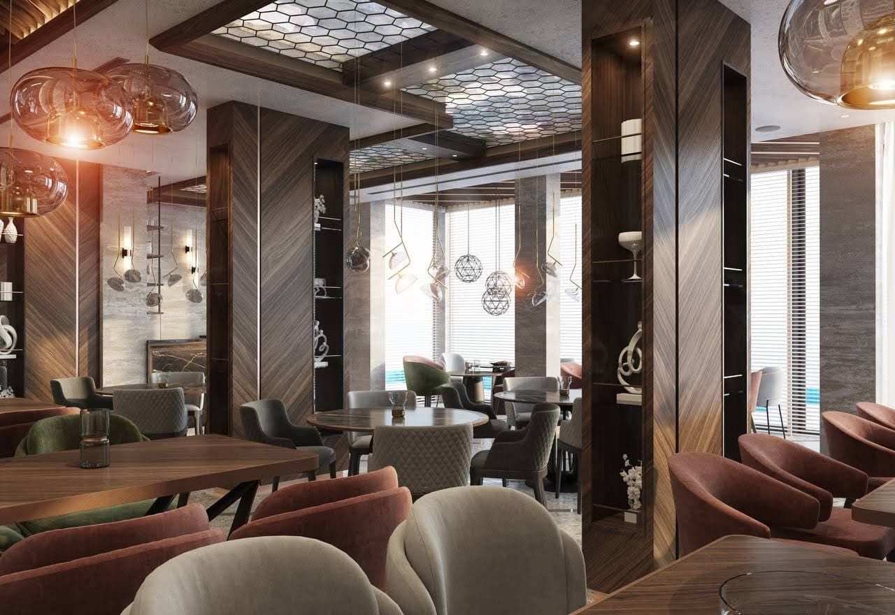 Villa restaurant interior in Petrovac, Montenegro: designer wood finishes, soft armchairs, and stylish lighting.