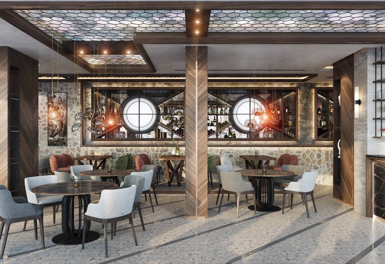 Interior of the villa restaurant in Petrovac, Montenegro: designer furniture, stonework, and stylish lighting.