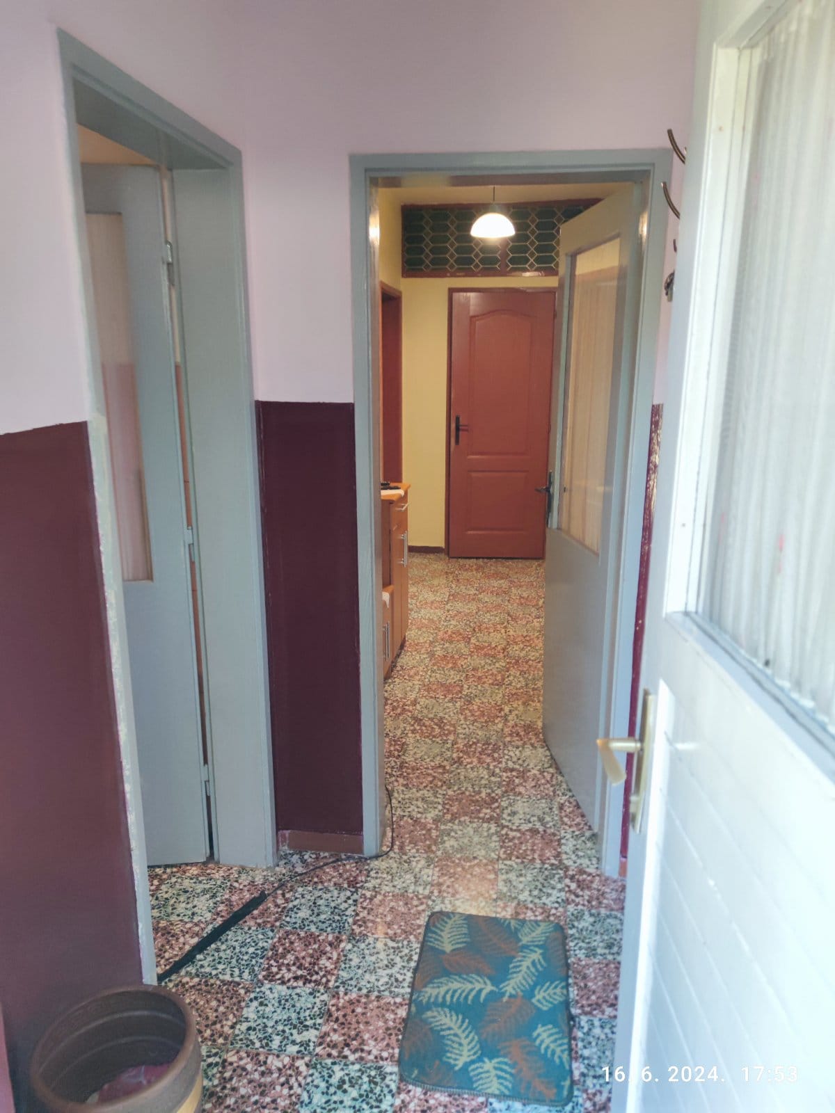 Hallway with terrazzo flooring and interior doors in a house for sale, Igalo, Montenegro.
