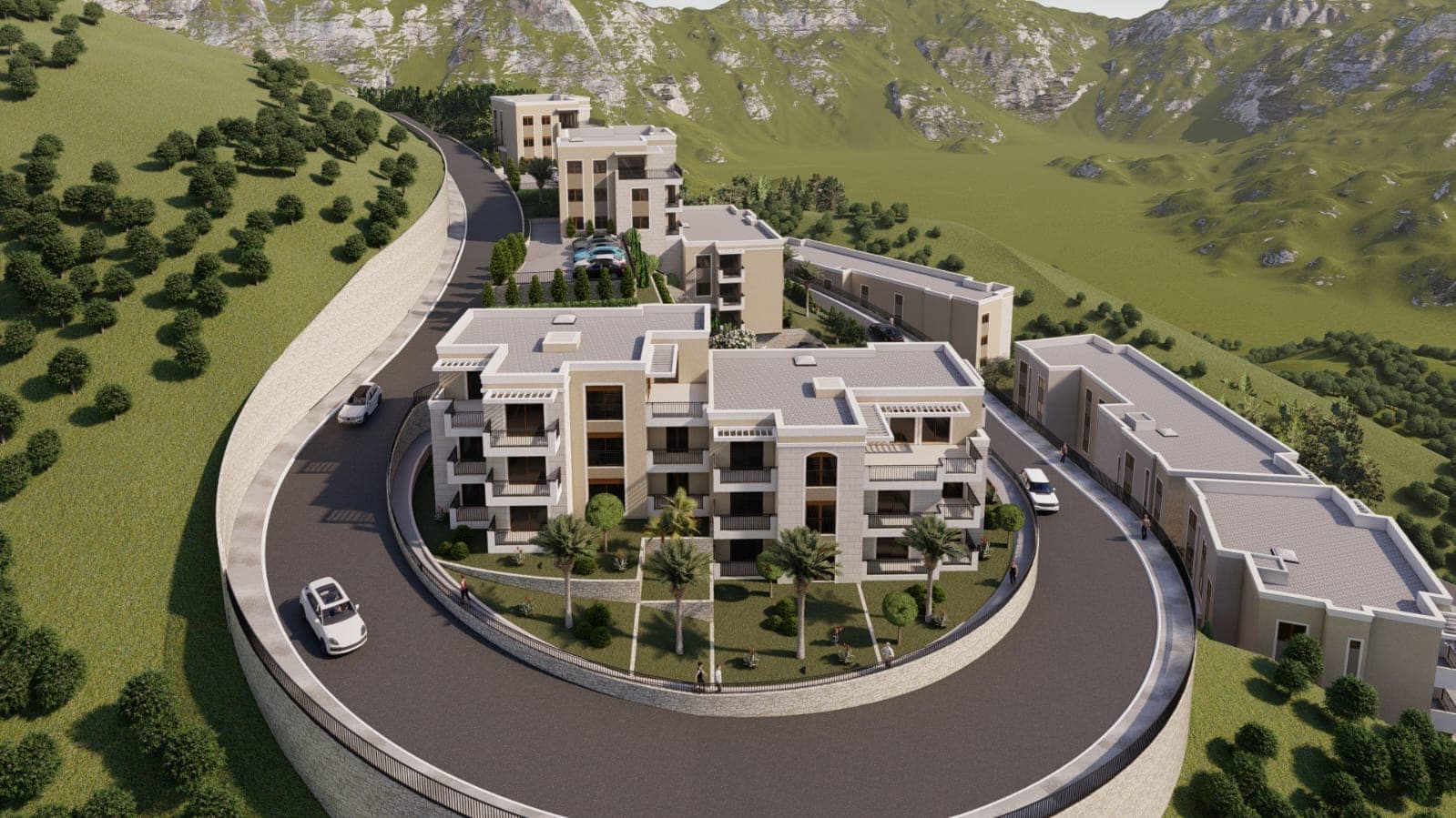 Top view of a residential complex in the mountains of Budva, Montenegro: modern buildings, landscaped grounds, and parking.