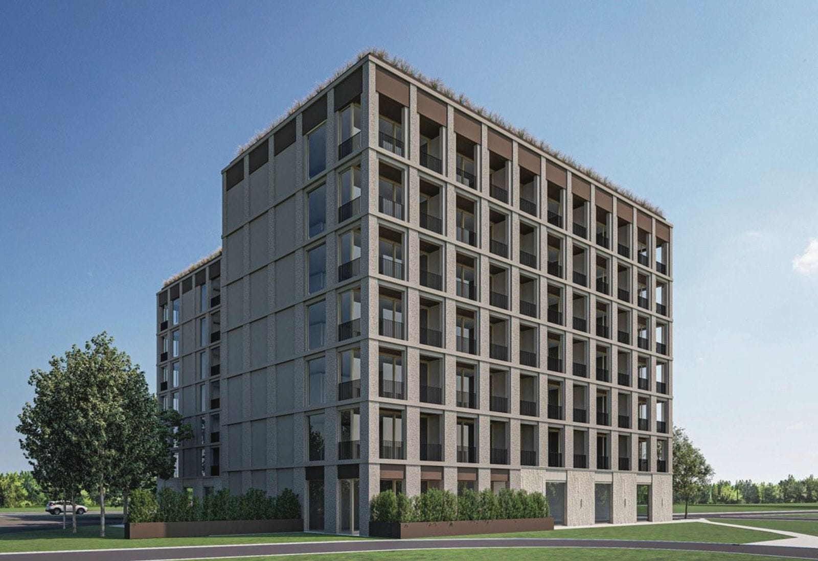 Modern residential complex in Budva, Montenegro: facade of a multi-story building with panoramic windows and balconies.