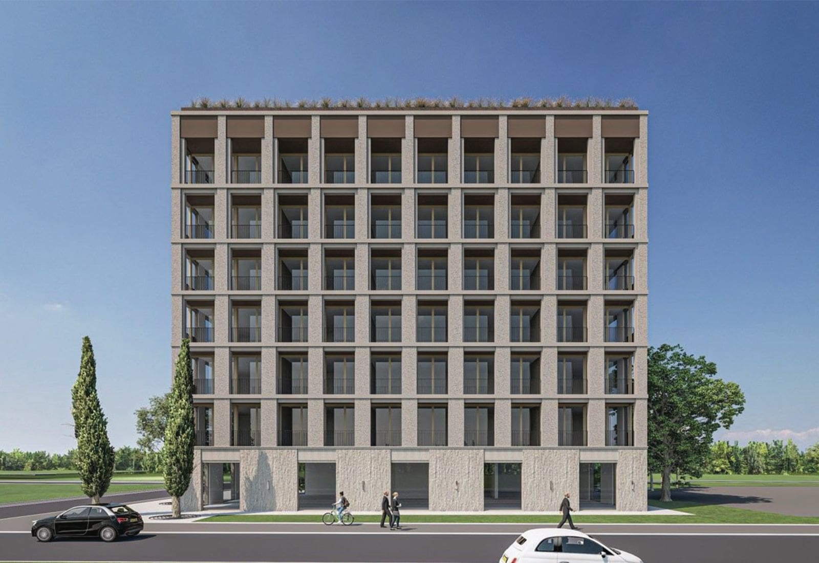 Modern residential complex in Budva, Montenegro: building facade with panoramic windows, balconies, and stone cladding.