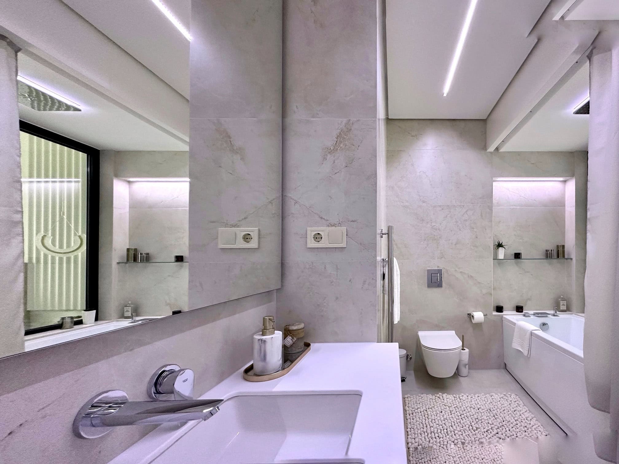 Modern bathroom in an apartment, Bečići, Montenegro: porcelain stoneware, built-in plumbing fixtures, and LED lighting.