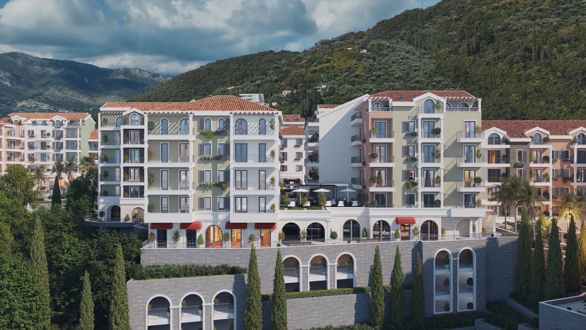 Modern residential complex with terraces and mountain views in Tivat, Montenegro: Mediterranean-style architecture.