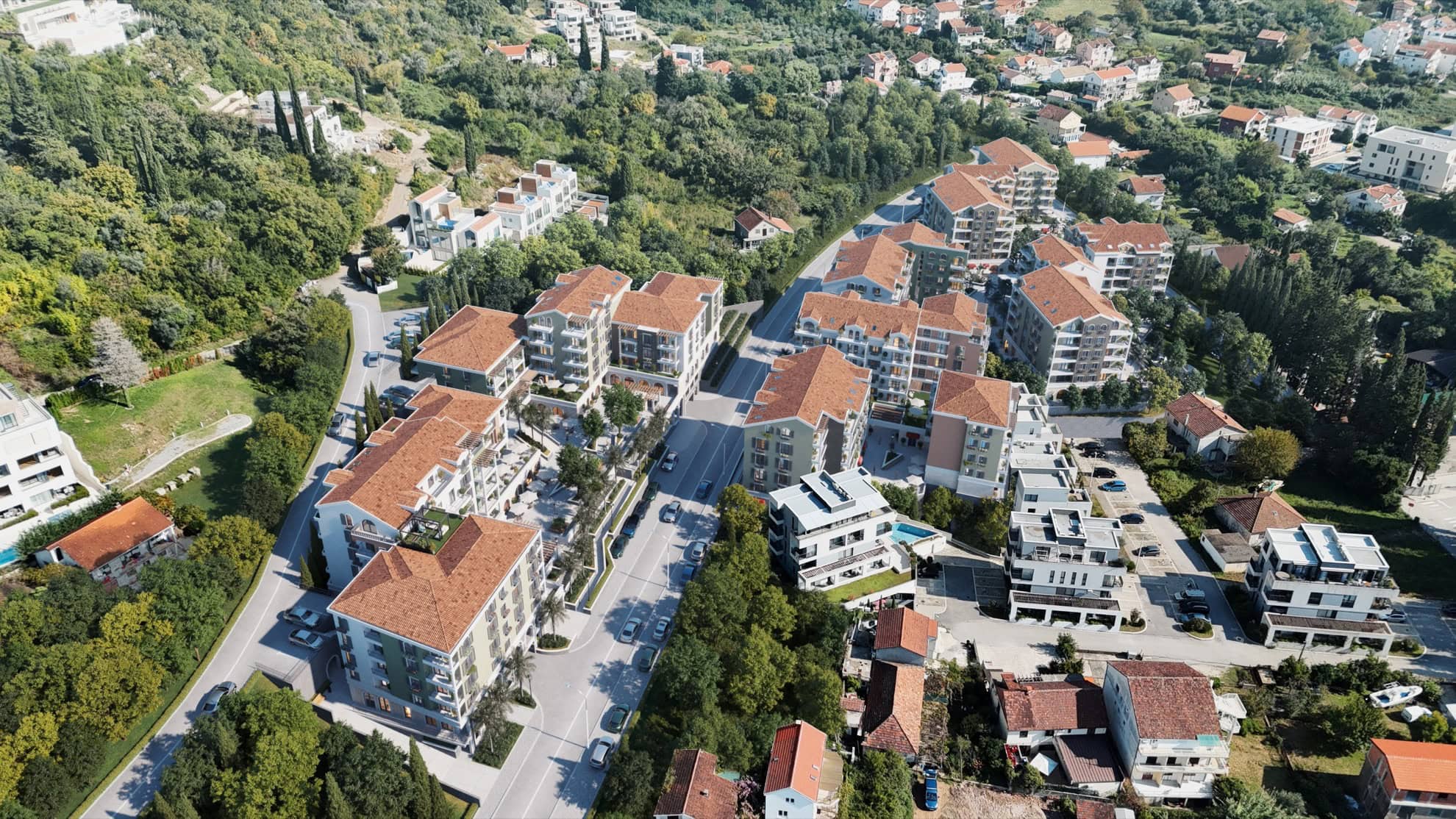 Aerial view of a residential complex in Tivat, Montenegro: modern houses with tiled roofs and landscaped grounds