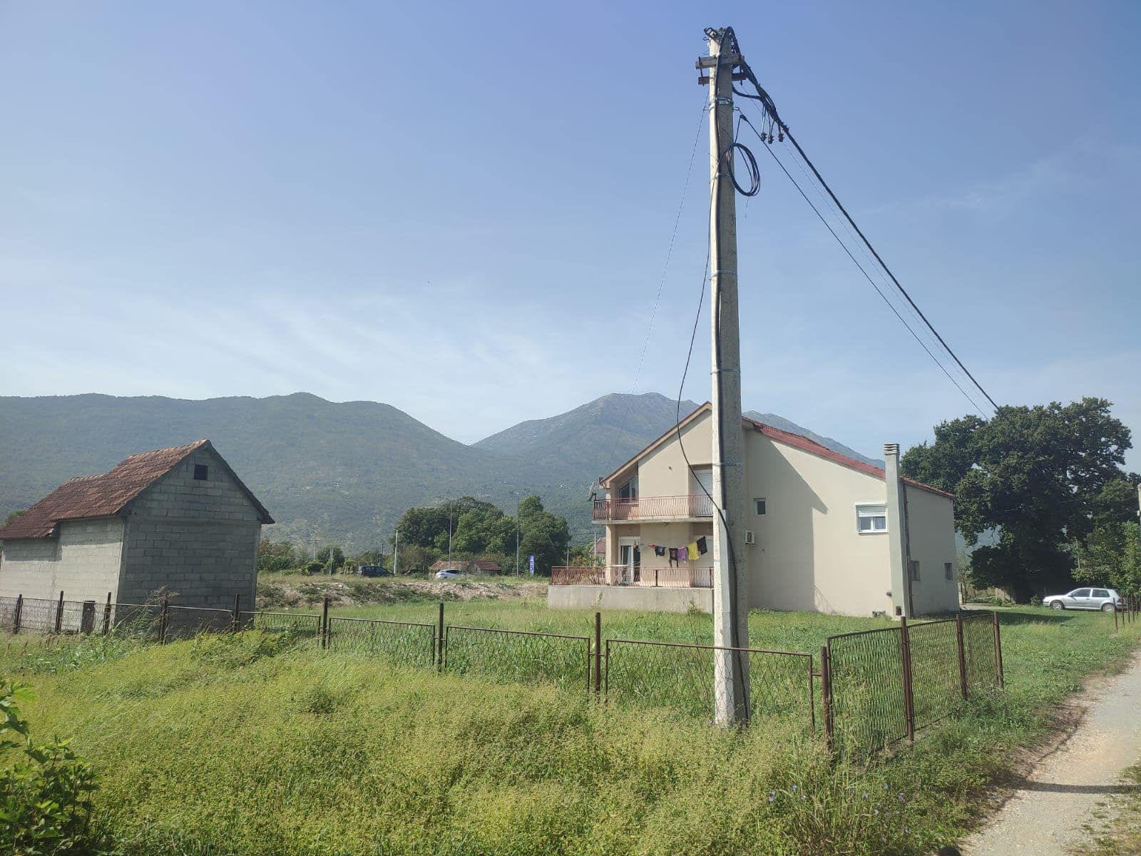 Two-story house with a plot and mountain views in Danilovgrad, Montenegro. Private house with an outbuilding.