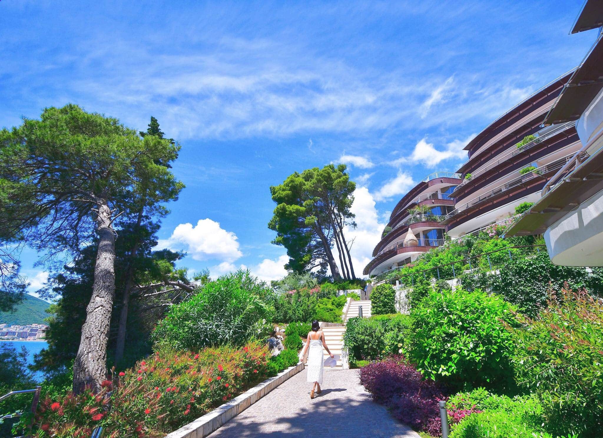 Modern residential complex in Budva, Montenegro: landscaped grounds with a garden and paths to the sea.