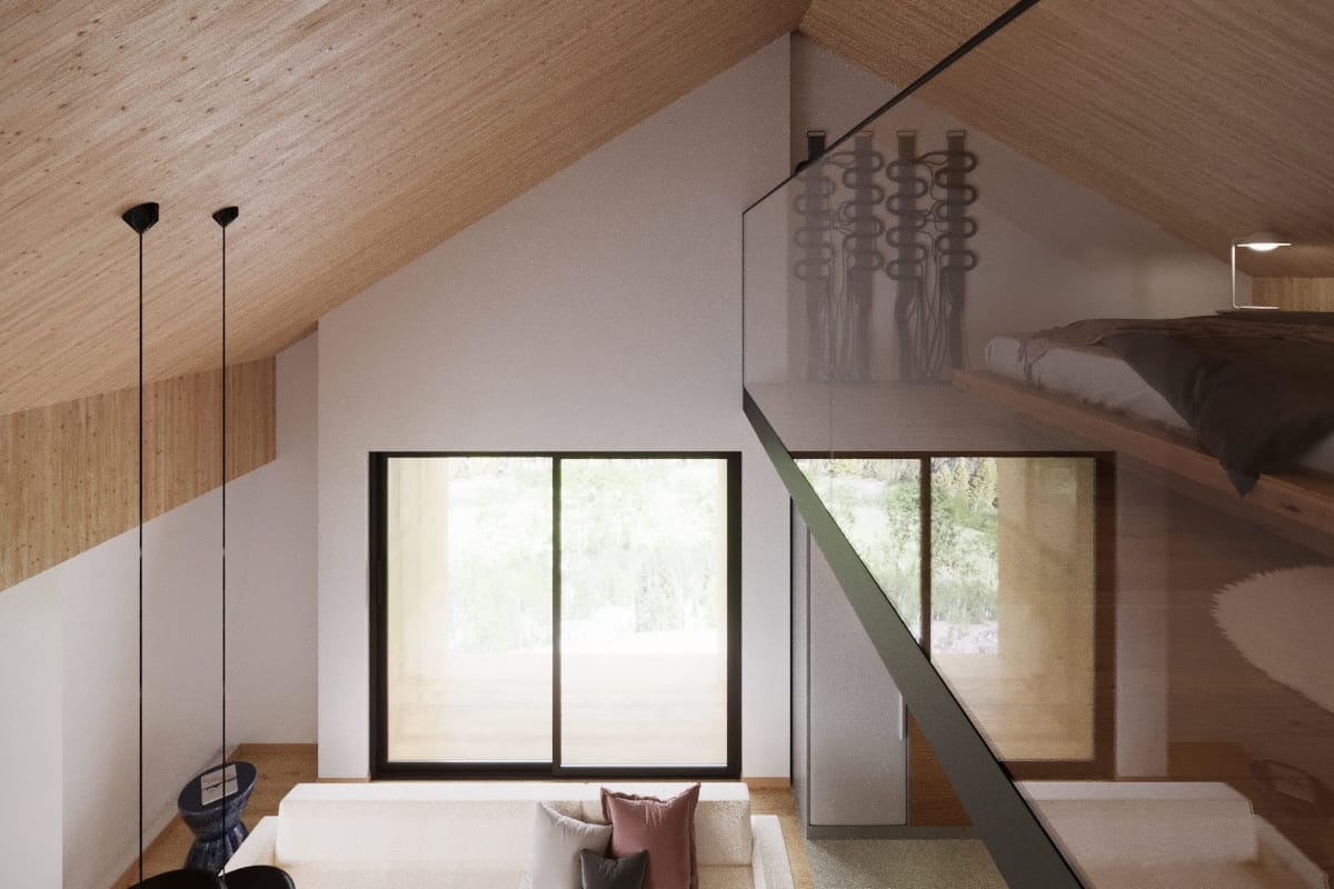 Living room interior with a vaulted ceiling and mezzanine in a residential complex, Kolasin, Montenegro.