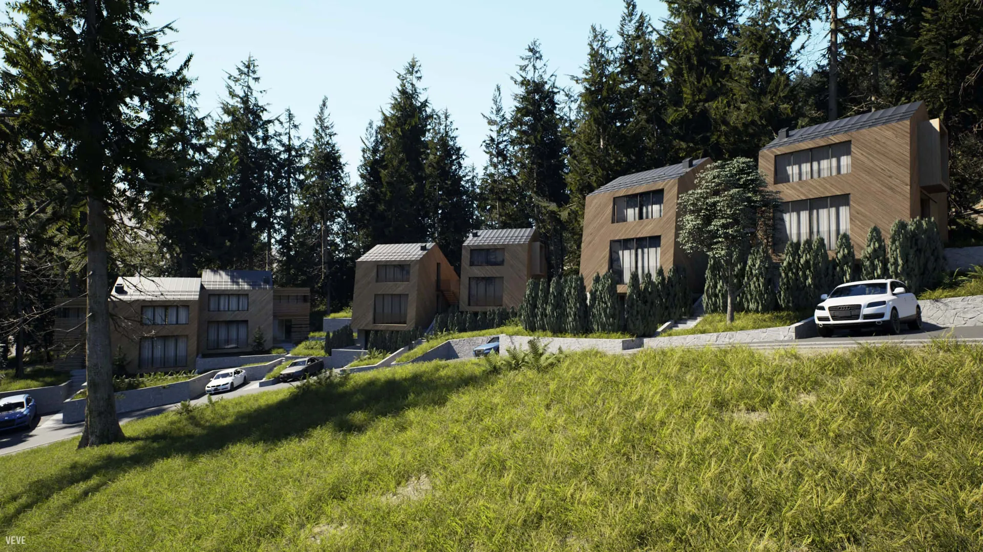 Exterior view of modern wooden houses on a forested slope with cars parked on the driveway.