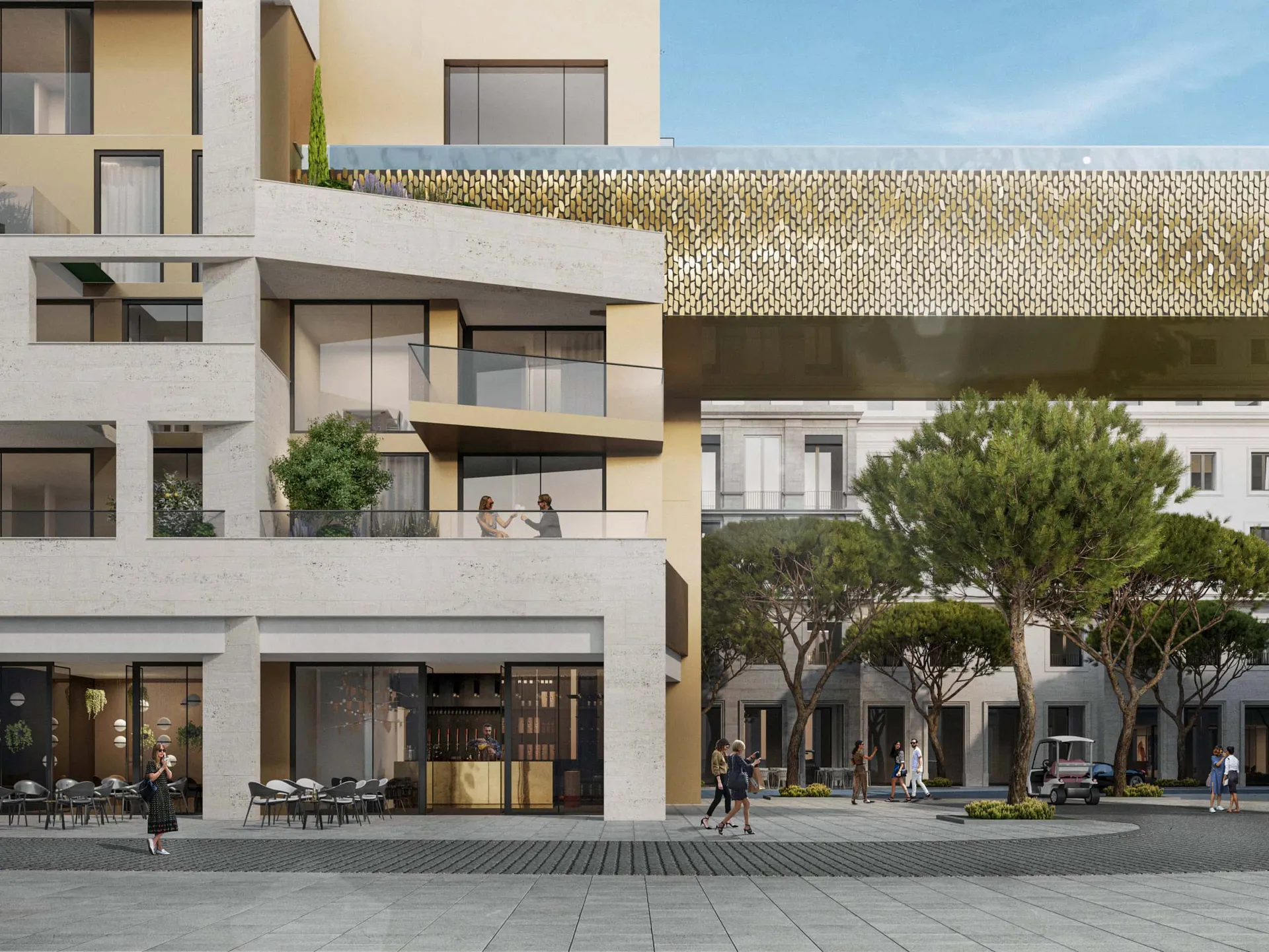 Modern building exterior featuring balconies, a gold decorative bridge, and a pedestrian plaza with trees and people.