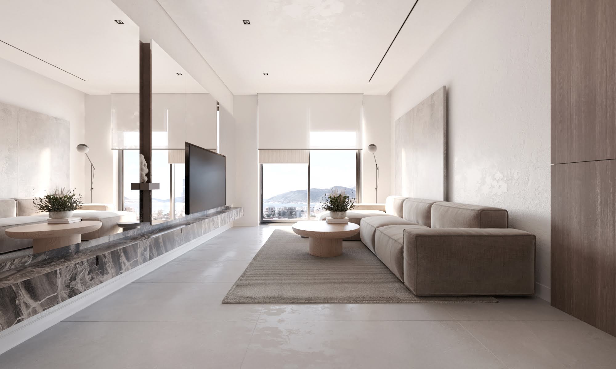 Modern living room in the Tivat residential complex, Montenegro: beige sofa, marble TV shelf, and panoramic sea view.