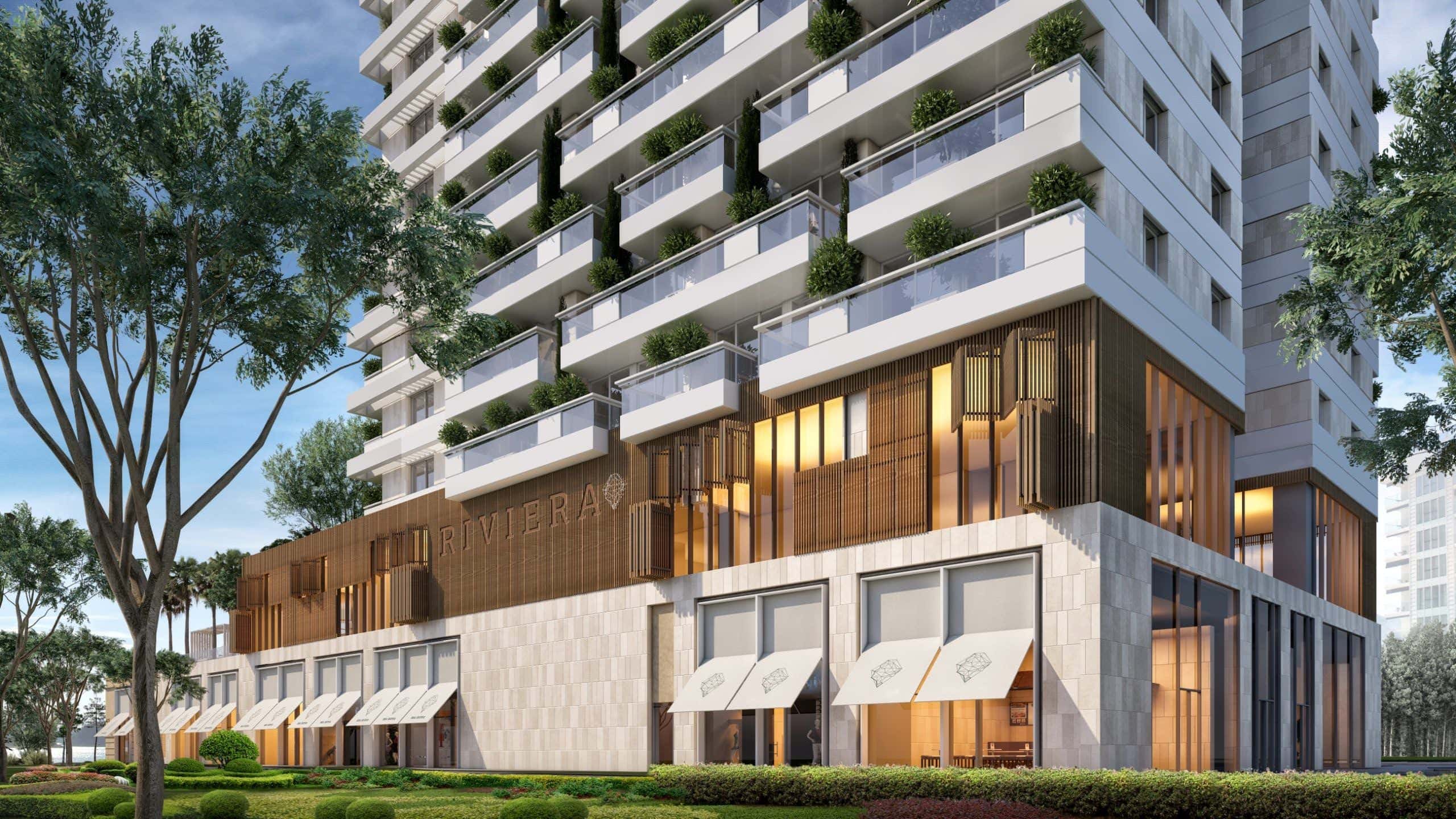 Modern residential complex Riviera in Budva, Montenegro: facade with terraces, landscaping, and commercial spaces.
