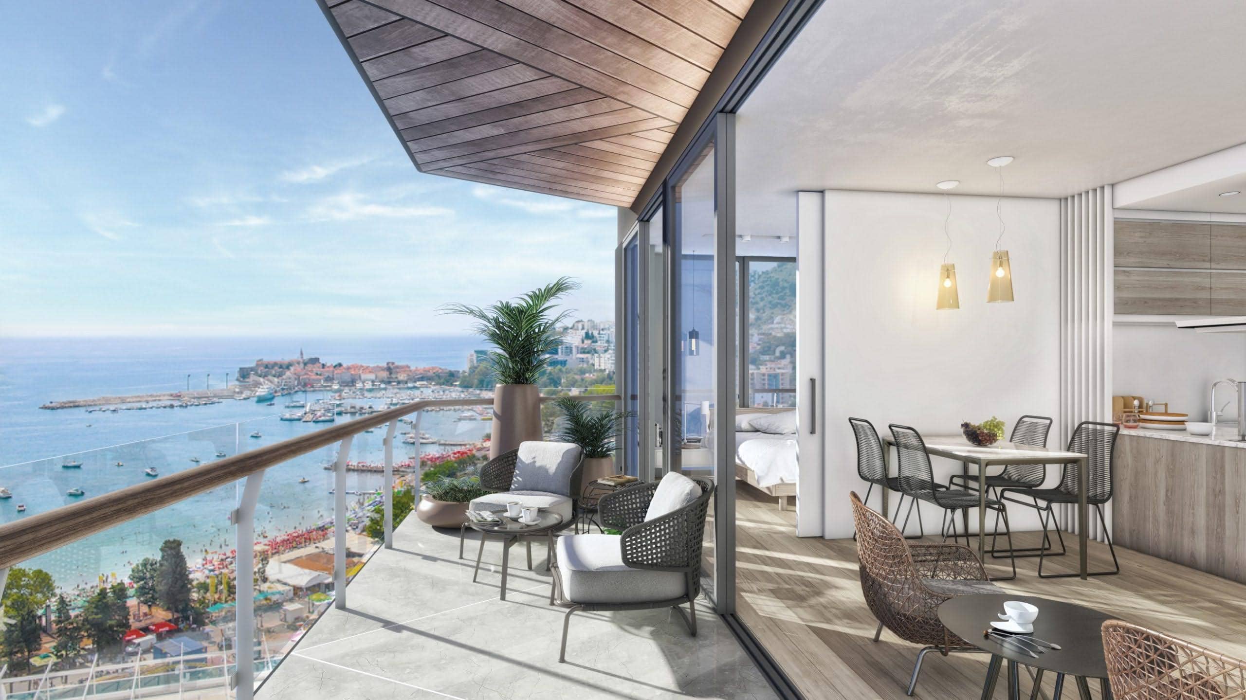 Terrace with sea and Budva views in residential complex No. 2170, Montenegro: wicker furniture, panoramic glazing, and modern design.