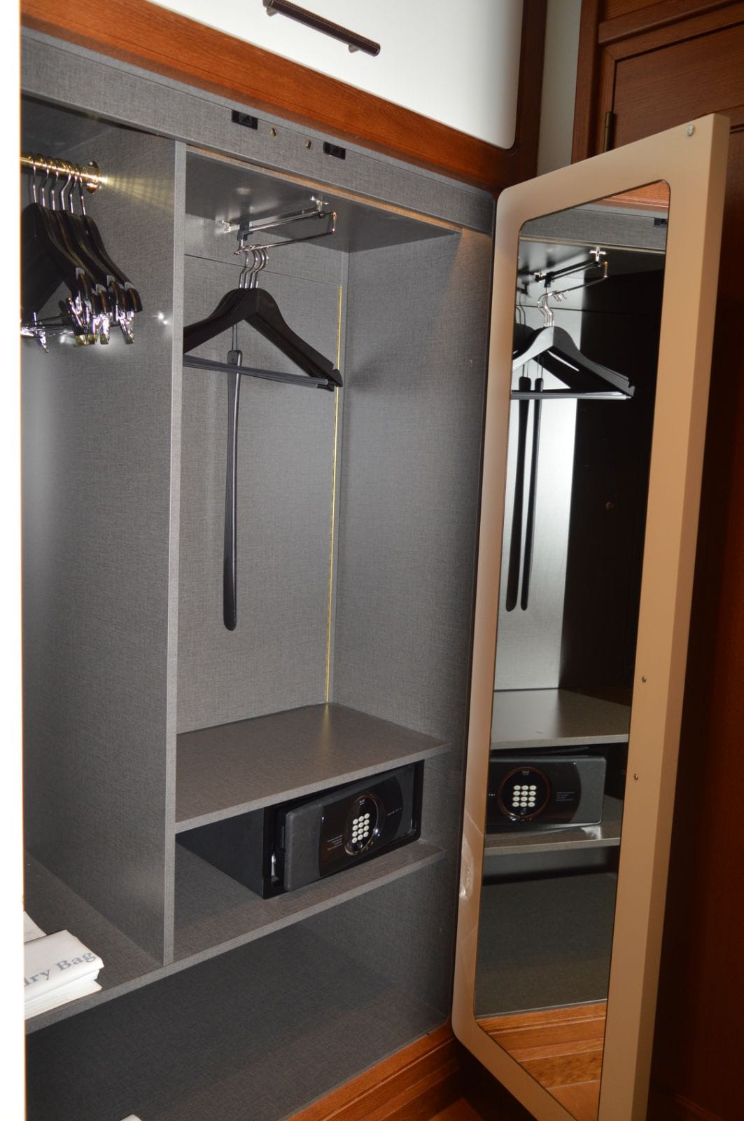 Built-in wardrobe with mirror and safe in the bedroom of an apartment in Tivat, Montenegro. Modern finishes and fittings.