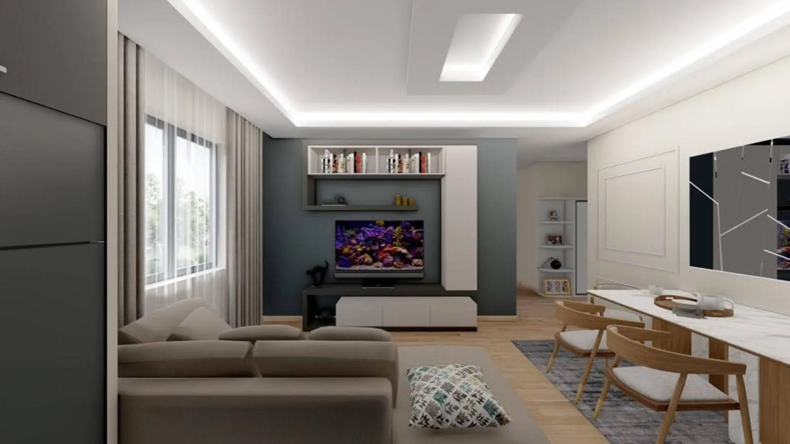 Modern living room with a grey sofa, wall-mounted TV unit, and a dining area visible on the right.