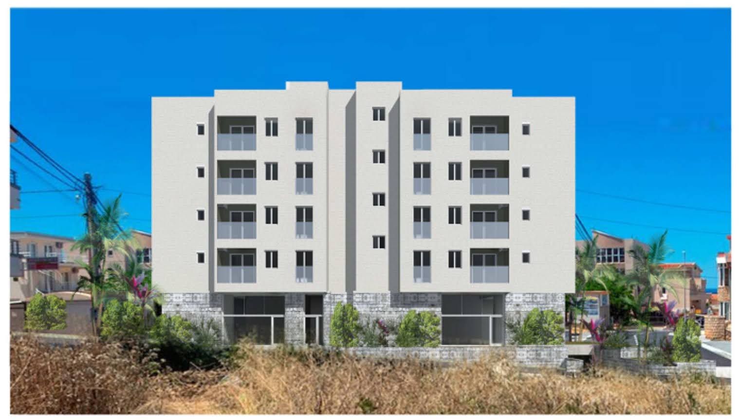 Modern residential complex in Dobra Voda, Montenegro: a 4-story building with balconies and panoramic glazing on the facade.
