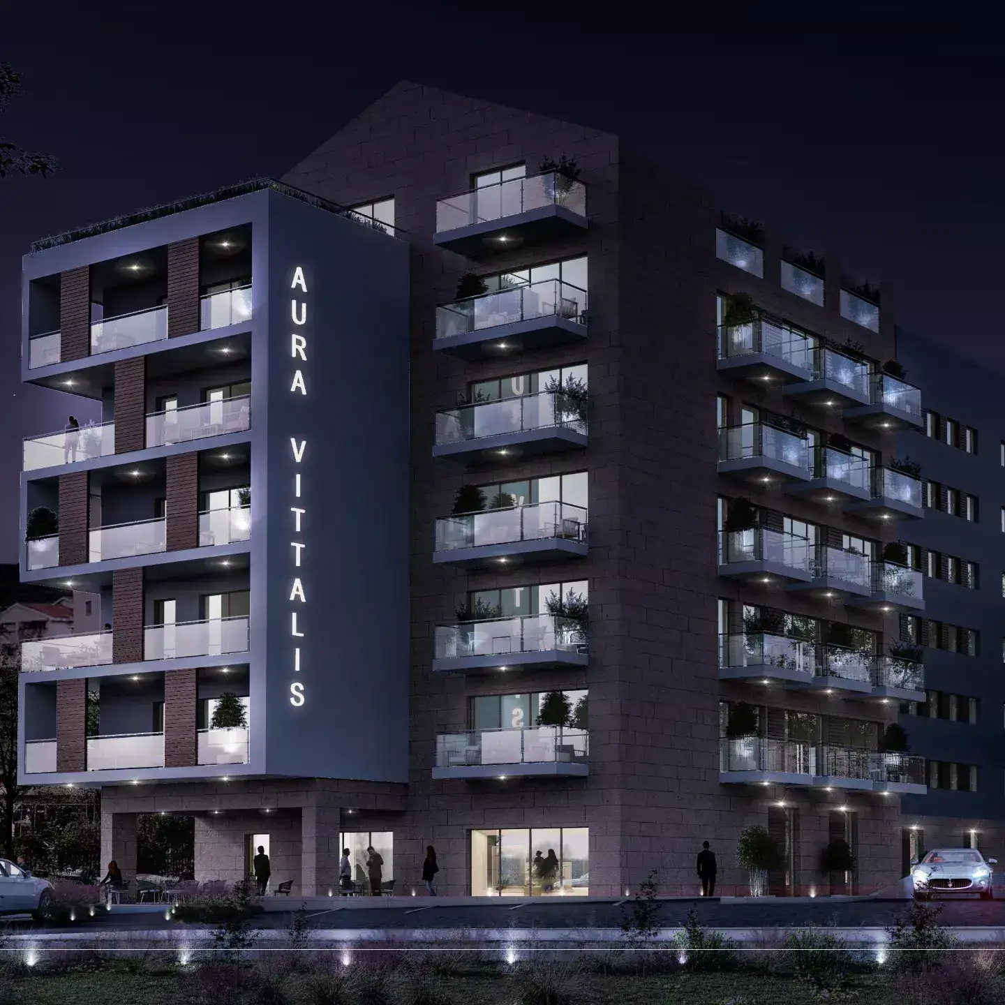 Modern residential complex Aura Vittalis in Budva, Montenegro: night facade with lighting and glass balconies.