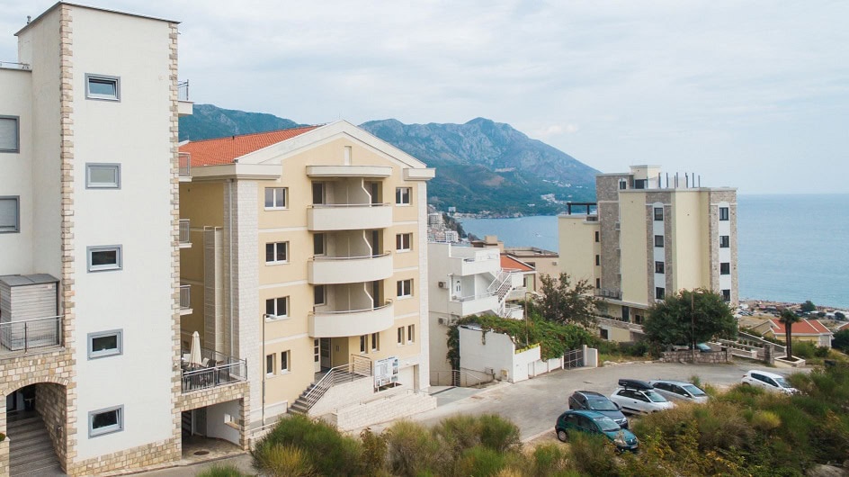 Modern residential complexes with sea and mountain views in Bečići, Budva Riviera, Montenegro.
