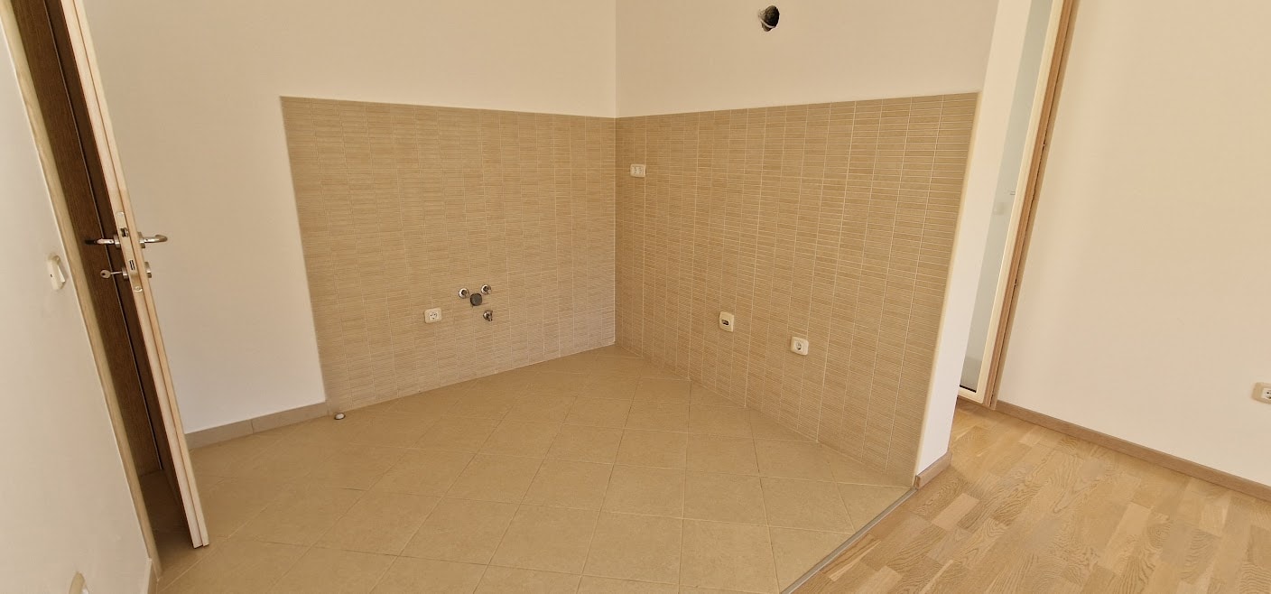 Kitchen area with tile and utility connections in an apartment in Bečići, Budva Riviera, Montenegro.