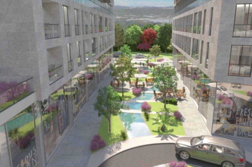 Modern residential complex in Bar, Montenegro: landscaped inner courtyard with landscaping and a swimming pool.
