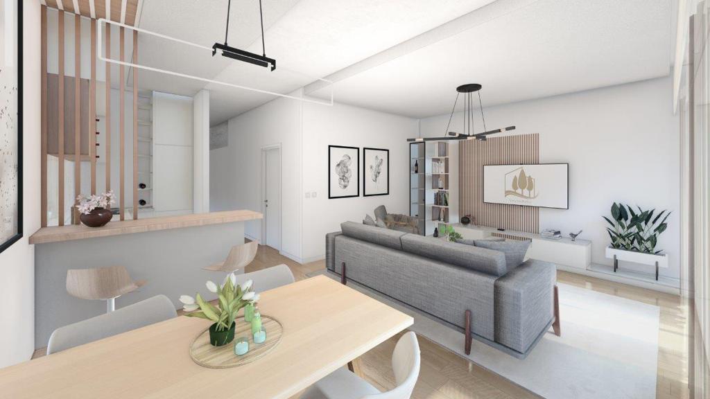 Modern living room with kitchen in Dobrota residential complex, Montenegro: stylish interior, soft furniture, and wood finishes.