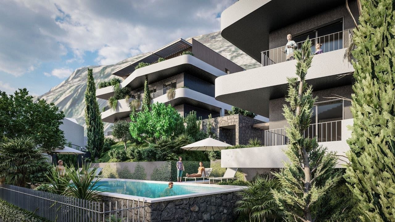 Modern residential complex with a pool and mountain views in Dobrota, Montenegro: architecture and landscape design.
