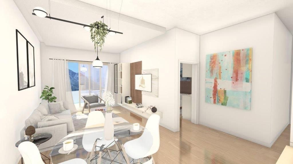 Modern living room in the Dobrota residential complex, Montenegro: bright interior, dining area, panoramic windows with mountain views.