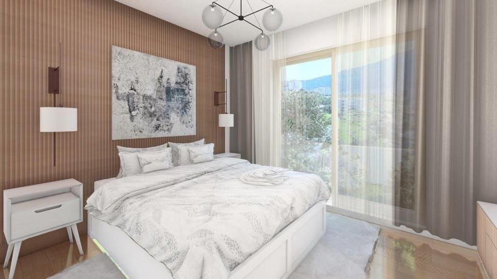 Modern bedroom with a double bed and mountain view in Dobrota residential complex, Montenegro: stylish interior, slatted wall panels.