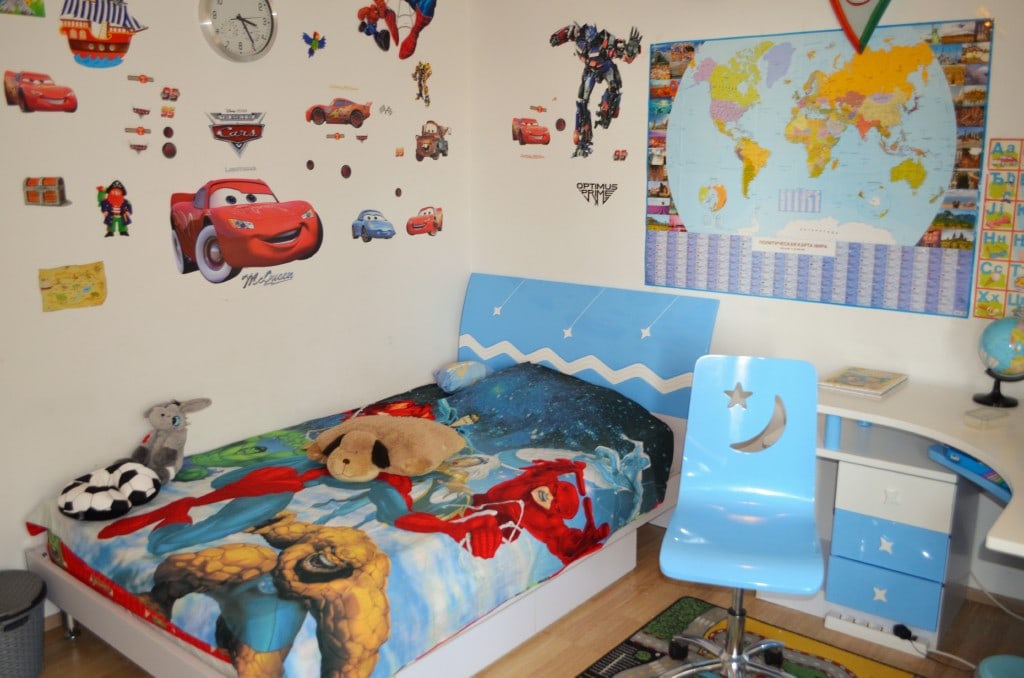 Children's bedroom in an apartment in Bar, Montenegro: bed, desk, and themed wall decor.