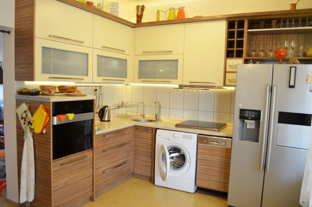 Modern kitchen in an apartment in Bar, Montenegro: built-in appliances, stylish cabinetry, and light finishes.
