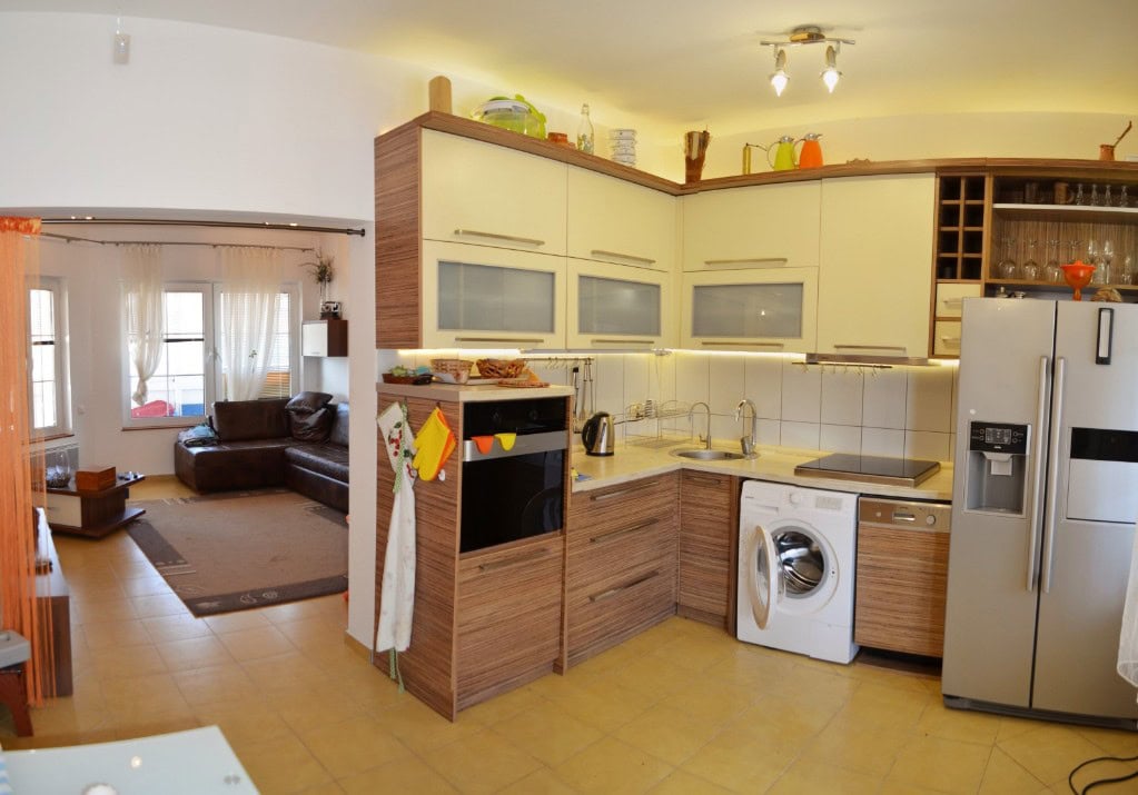 Kitchen-living room with modern furniture and appliances in the apartment, Bar, Montenegro.