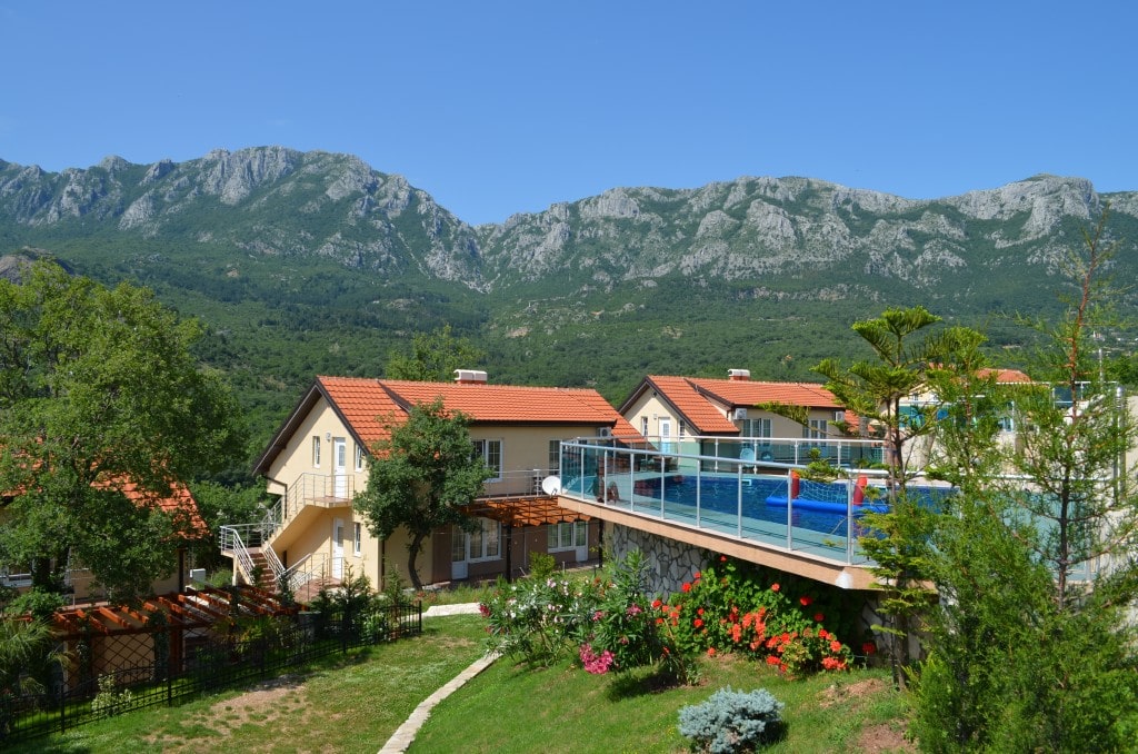 Two-story apartments with a pool and mountain views in Bar, Montenegro. Cozy grounds with a garden and terrace.