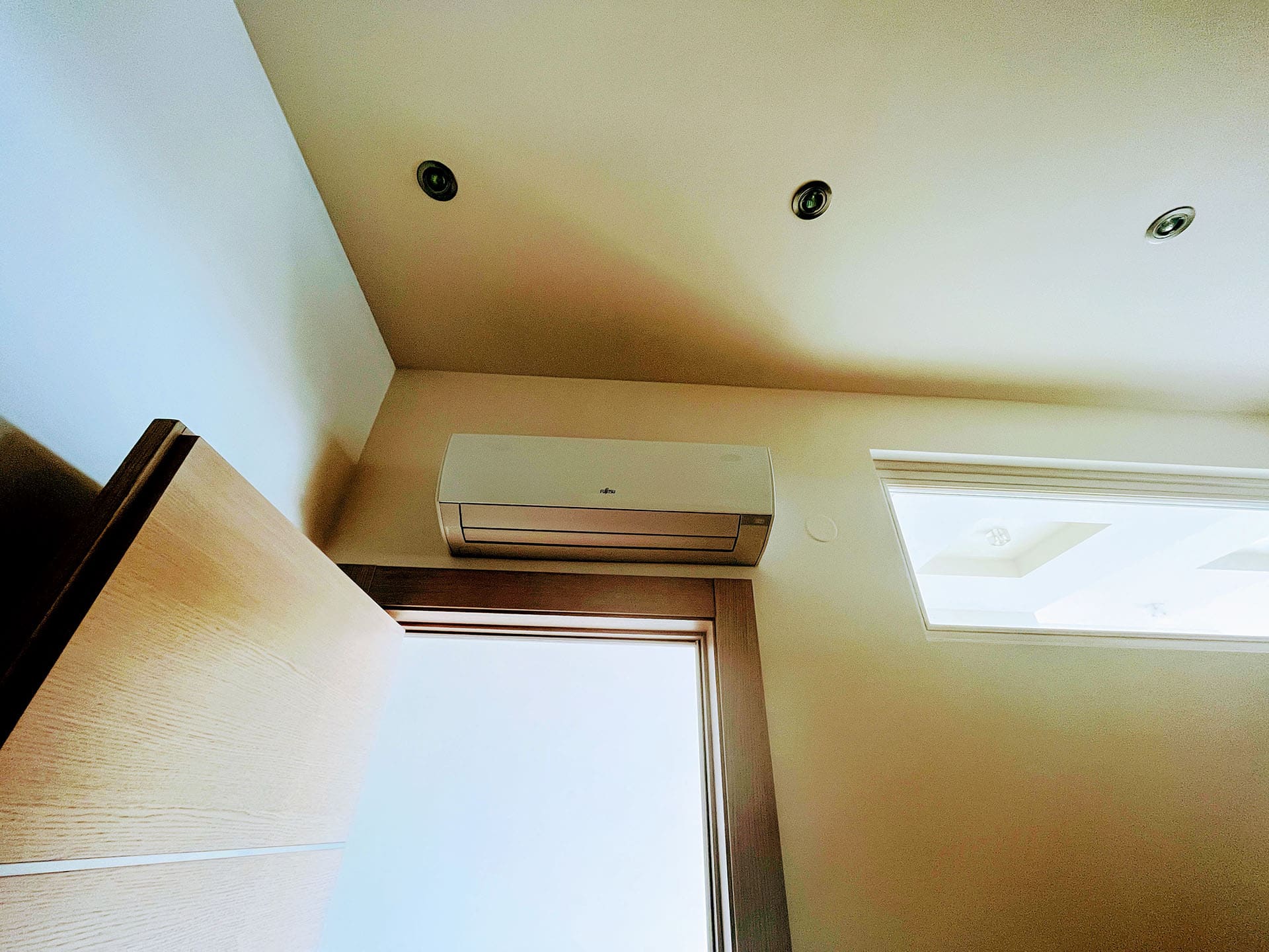 Fujitsu air conditioner and recessed lighting in a modern apartment in Budva, Montenegro.