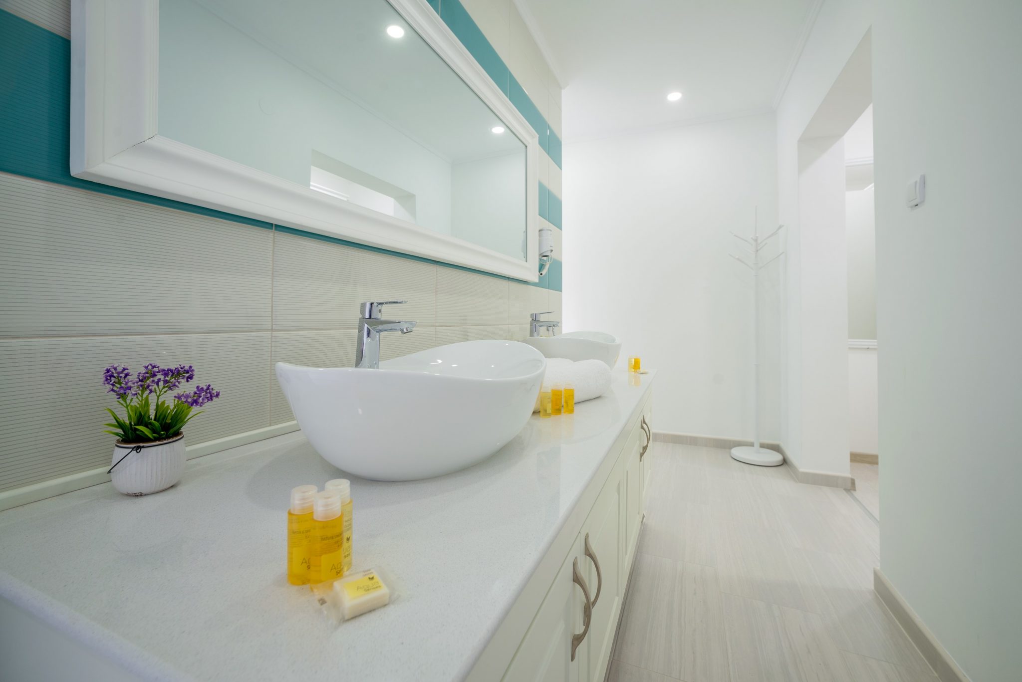 Modern bathroom with two sinks in a villa in Stoliv, Montenegro: stylish finishes and a bright interior.