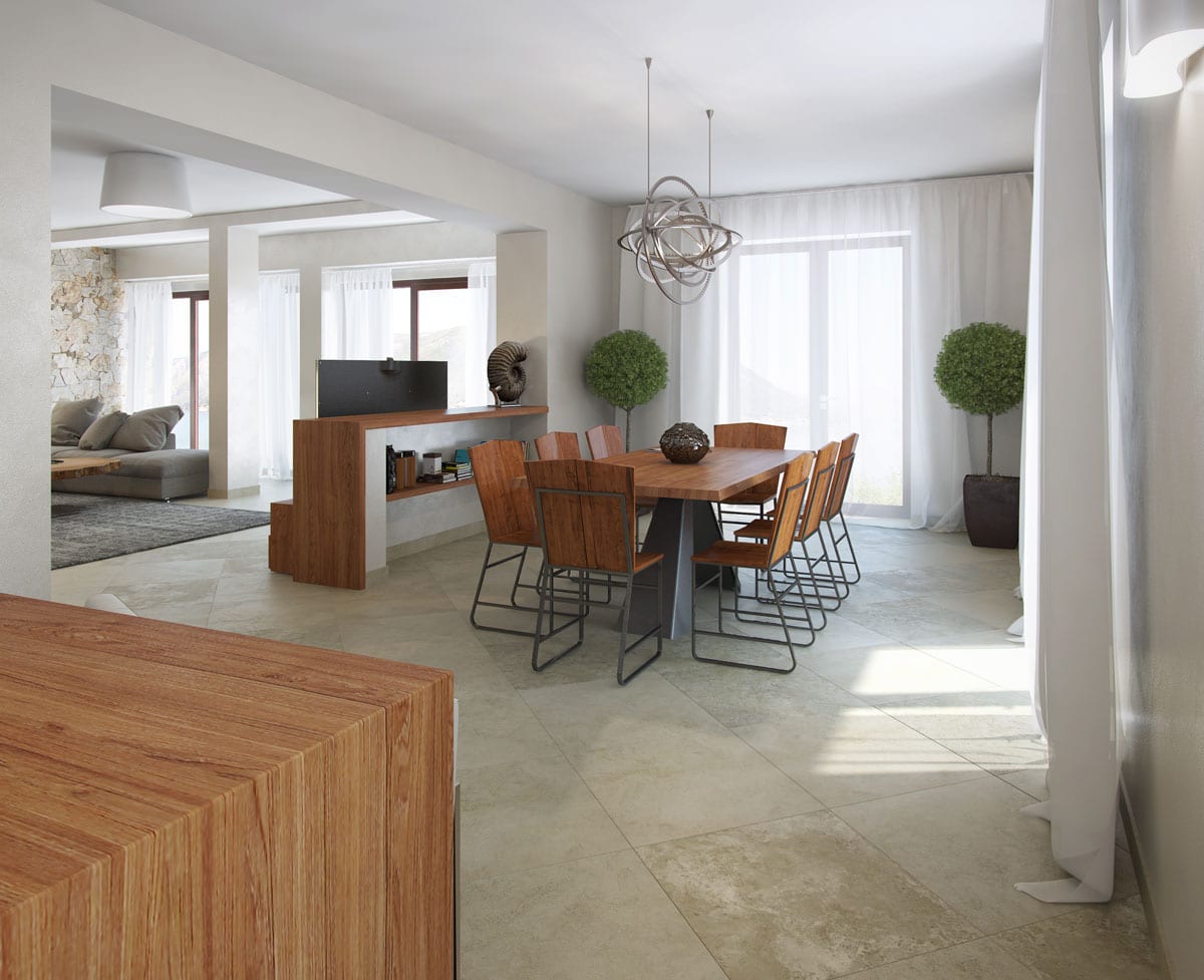Living room interior with dining area in a villa in Dobrota, Montenegro: wooden table, stylish furniture, and light flooring.